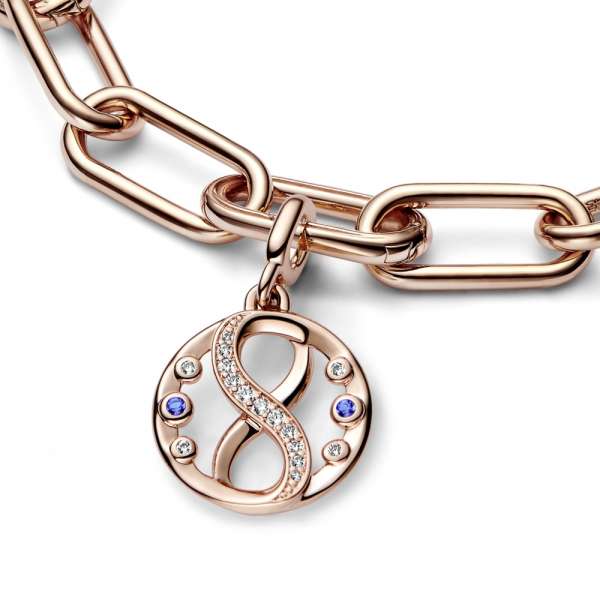 Infinity 14k rose gold-plated medallion with clear cubic zirconia and stellar blue crystal 