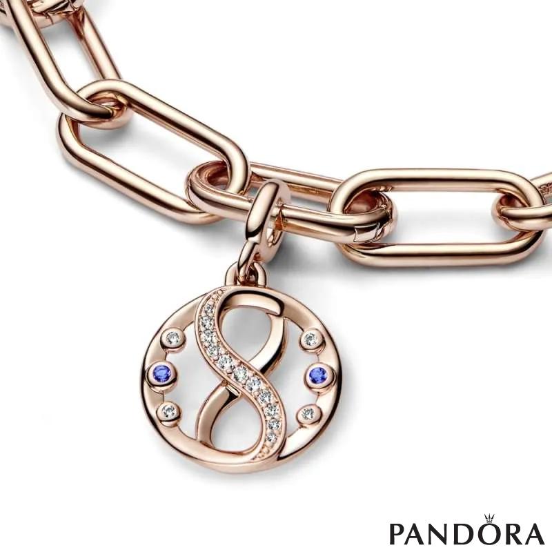 Infinity 14k rose gold-plated medallion with clear cubic zirconia and stellar blue crystal 